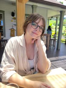 Alexis sitting on a sunny verandah